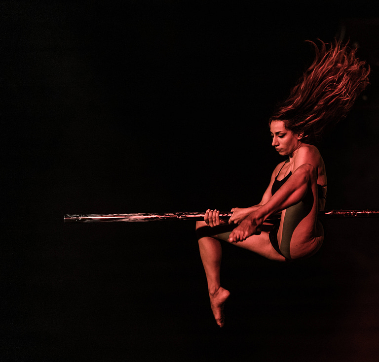 A photo of a agirl pole dancing